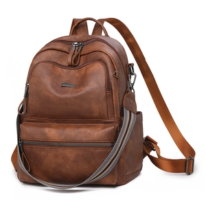 Vintage dark brown women's backpack with multiple zippers and a colorful woven strap