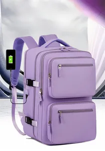 Detail of lavender business backpack featuring dual front pockets and external USB charging port