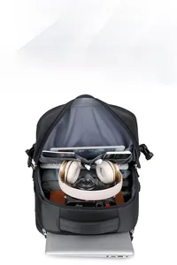 Internal view of a multi-layer business backpack showing laptop and camera storage