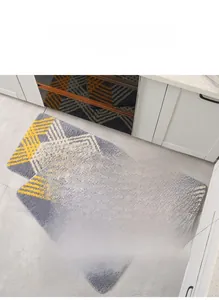 Detail of two-piece absorbent kitchen mats with yellow and grey geometric pattern