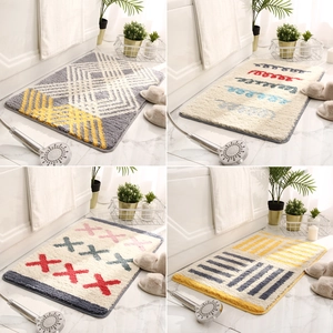 Tapis de bain absorbants modernes aux motifs géométriques et textures douces variés