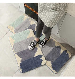 Detail view of two-piece soft geometric kitchen rugs with modern plush texture