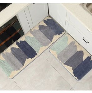 Detail view of two-piece soft plush kitchen rugs with modern geometric mosaic pattern