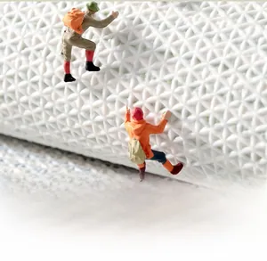 Macro shot showing non-slip geometric texture of a thickened bathroom mat with climber models