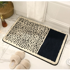 Detailed view of thick absorbent bathroom mat with leopard print and navy blue design