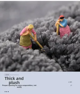 Macro detail of thick grey plush bathroom mat showing dense fiber texture and high absorbency