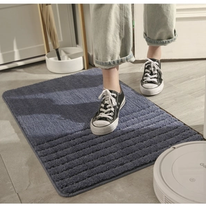 Close-up of the deep blue-gray striped absorbent rug with durable edge stitching
