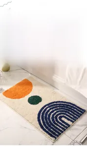 Close-up of modern geometric bathroom mat with colorful plush texture and non-slip bottom