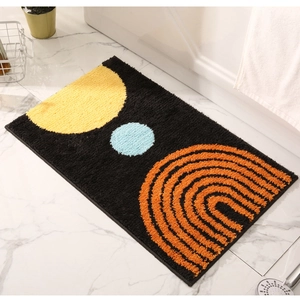 Detailed plush bathroom mat texture featuring modern abstract geometric patterns on black