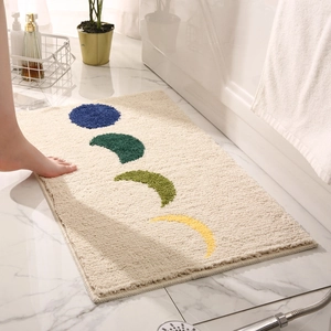 Tapis de bain absorbant en peluche avec motifs phases de lune sur sol en marbre