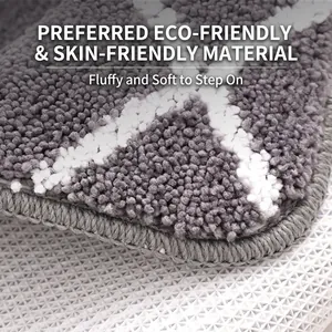 Plush gray and white striped bathroom mat with soft absorbent fibers and non-slip backing