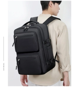 Detail view of large capacity business backpack with multiple pockets and durable fabric