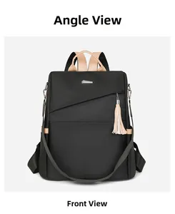Front view of black nylon backpack with beige leather handle and metal logo plate