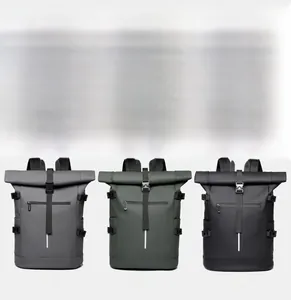 Three waterproof roll-top backpacks in grey, green, and black with adjustable buckles