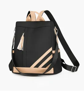 Side view of contrast color PU leather backpack with tassel and adjustable straps