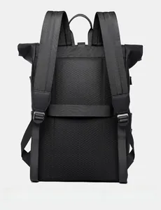 Black roll-top backpack back view with breathable mesh padding and luggage strap