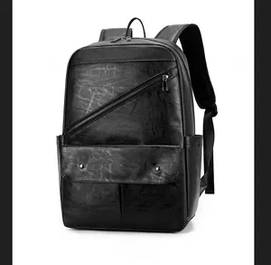 Detail view of the black PU leather backpack showing side pockets and padded mesh straps