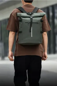 Army green roll-top tactical backpack with reflective strip and waterproof fabric detail