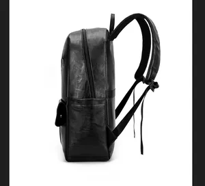 Detailed side view of black PU leather travel backpack with silver zippers and padded straps