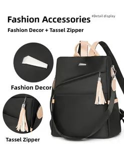 Detail view of nylon backpack featuring beige tassel zipper and metal triangle decor