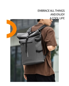 Detail of dark grey waterproof roll-top backpack with functional side buckles and sleek finish