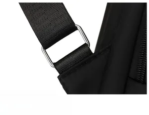 Close-up of durable metal hardware and nylon strap stitching on the black backpack