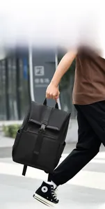 Detail of waterproof black business backpack with buckle closure on urban street