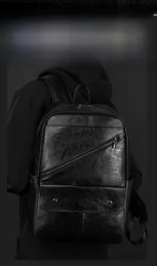 Close-up of black PU leather business backpack with front diagonal zipper and metal hardware
