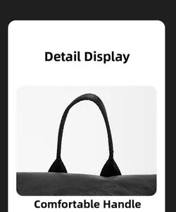 Detailed view of the comfortable top handle on this vintage black PU leather business backpack