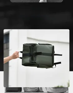 Detail view of the green tactical backpack side strap and buckle in outdoor setting