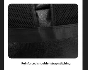 Close-up of reinforced stitching on the leather strap and breathable mesh of the backpack