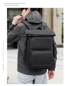 Detail of waterproof matte black thermal backpack with roll-top and zipper pocket