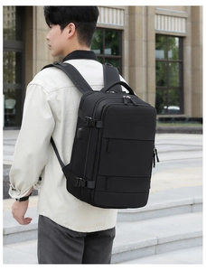 Macro detail of waterproof nylon backpack showing side USB port and durable buckle strap