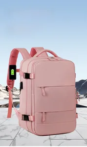 Pink waterproof nylon backpack with external USB charging port for smartphones