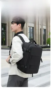 Side view of black nylon travel backpack with waterproof fabric on male model