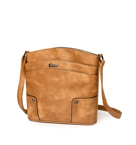 Detail view of vintage camel PU leather crossbody bag with geometric metal buckle and rivets