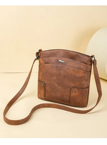 Close-up of brown vintage PU leather crossbody bag with multi-layer zipper compartments