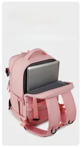 Pink travel backpack showing a 15.6-inch laptop compartment with padded shockproof lining