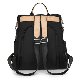 Zaino da donna in nylon nero impermeabile con manici in pelle marrone e vista sul retro