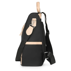 Multifunctional black PU leather patchwork backpack with brown trim from a side view
