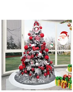 Detail of grey and white Merry Christmas tree skirt with decorative holiday gift boxes