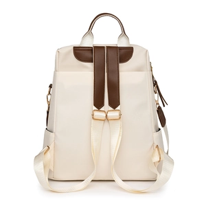 Sac à dos chic en tissu Oxford beige pour femme avec garnitures en cuir brun et métal doré