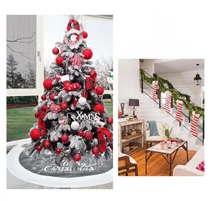 Detail of grey Merry Christmas tree skirt with festive red baubles and star ornaments