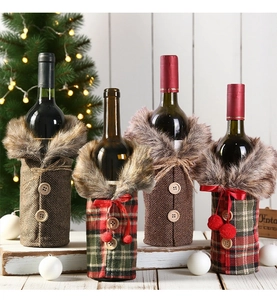 Detail of Christmas wine bottle covers featuring plaid fabric and faux fur collars