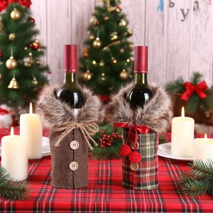 Detailed view of plaid Christmas wine bottle covers with faux fur collars and buttons