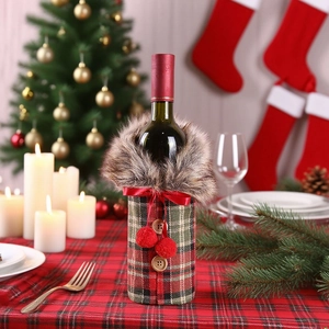 Detail of Christmas wine bottle cover with red plaid pattern and faux fur collar