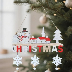 Christmas wooden plaque with red snowman and letters hanging on a decorated tree branch