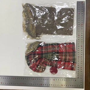 Flat lay detail showing size measurements for brown and red plaid dog hats with fur lining