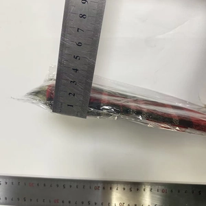 Close-up measurement of a red and black plaid Christmas wine bottle cover with faux fur trim