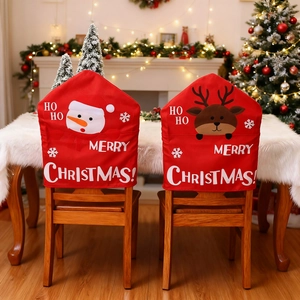 Detailed view of Christmas chair covers with snowman and reindeer patterns and festive text